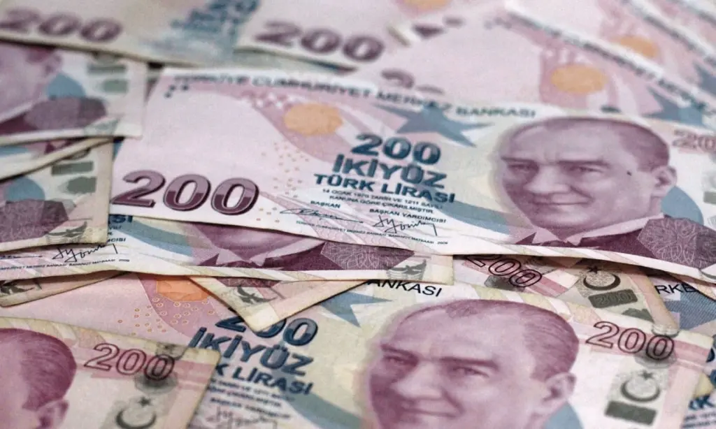 Turkish lira drops to record low against US dollar after 1% rate cut