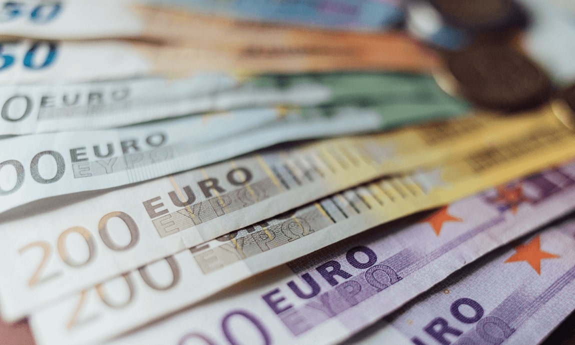 Euro tops $1.10 on strong economic data and a falling dollar